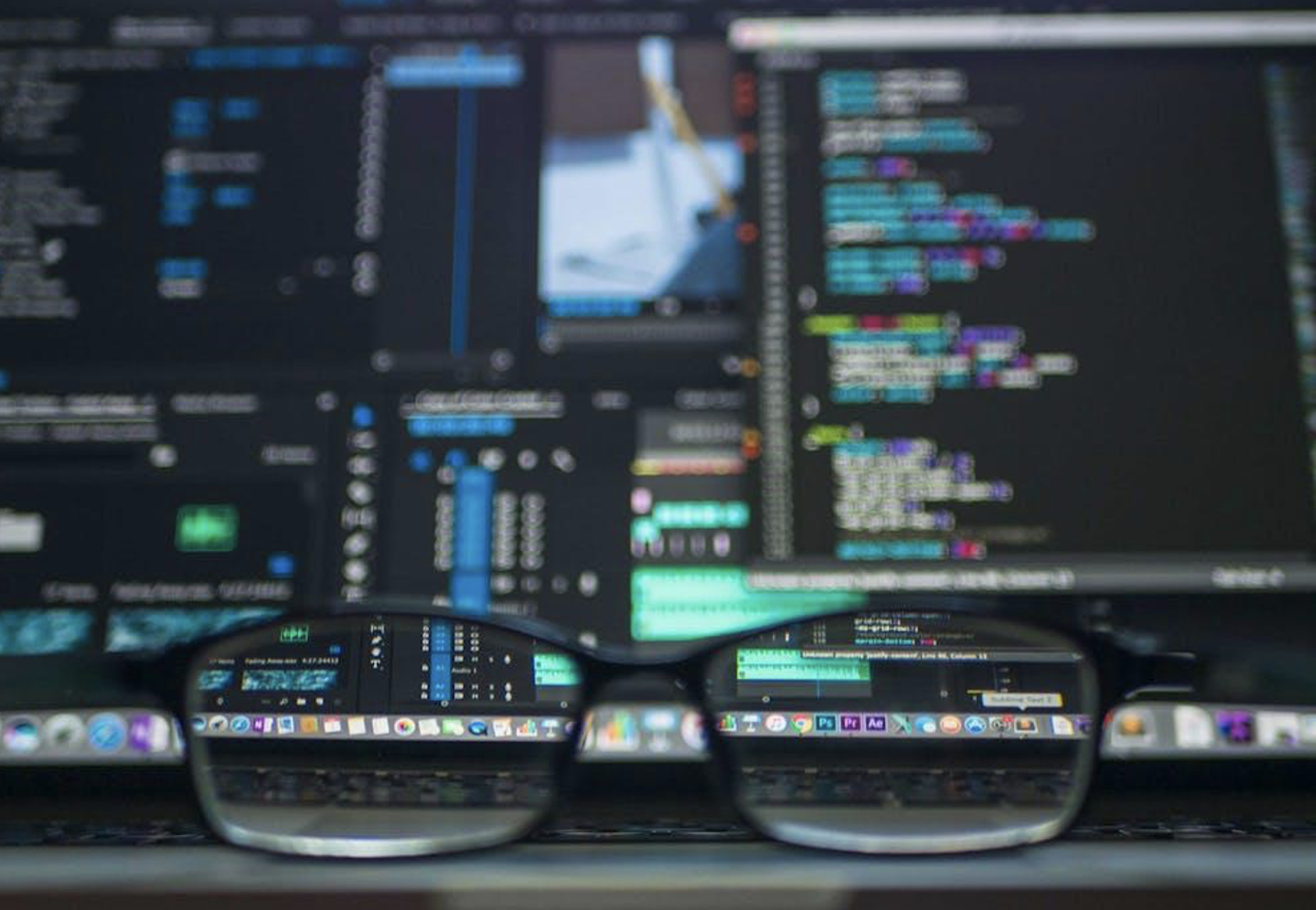 spectacles placed in front of a system displaying digital code